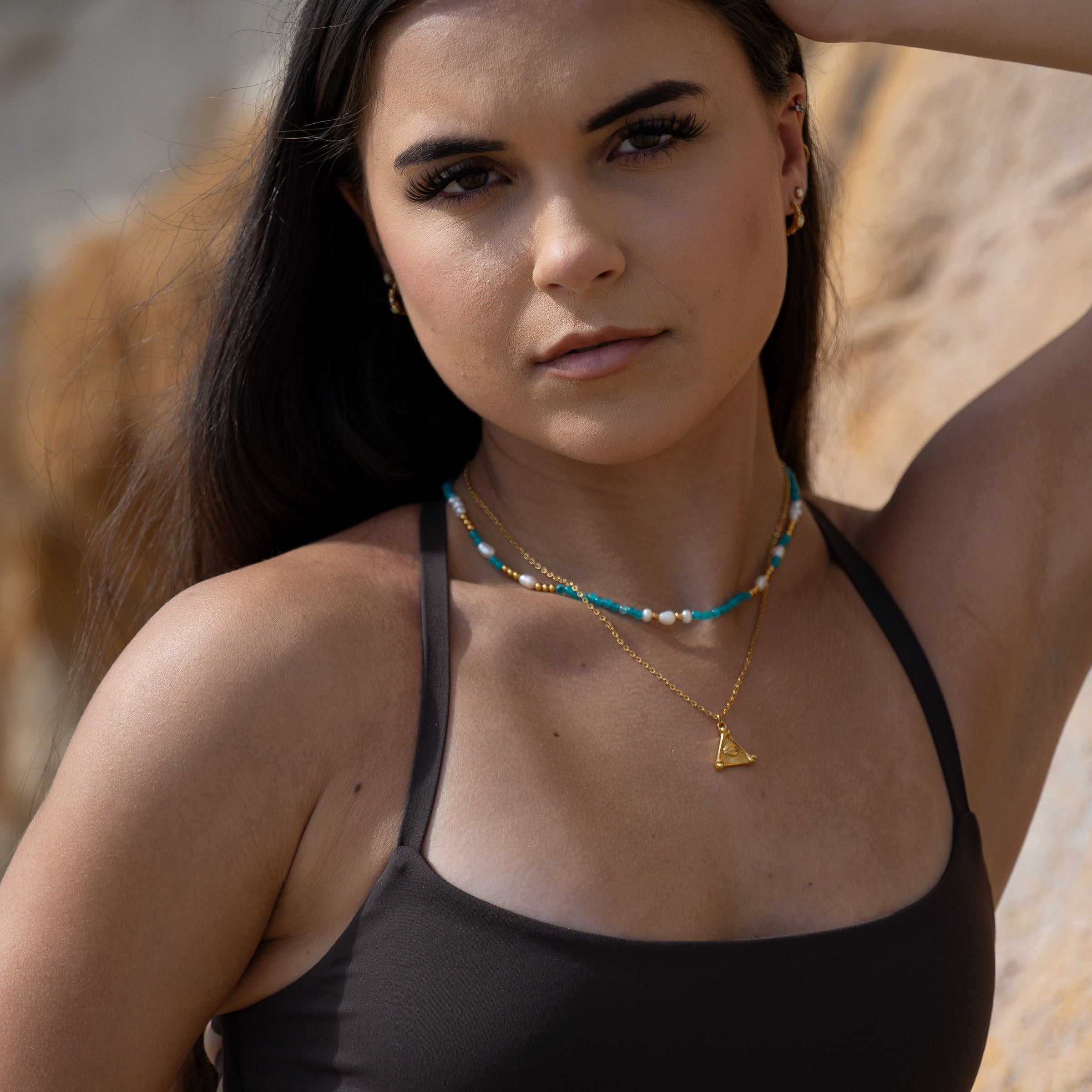 Gold necklace stack with Azure Eye pendant inspired by ocean tones