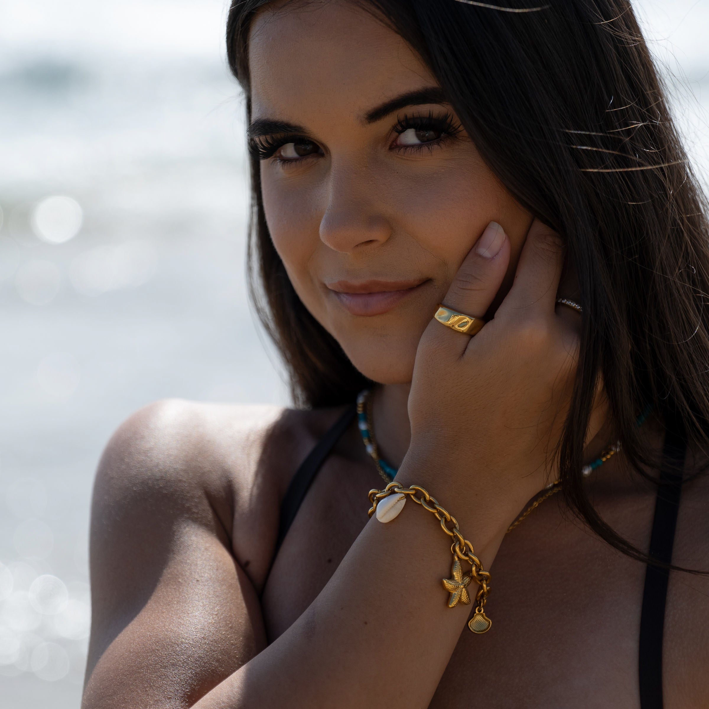 Gold sculpted wave ring close-up – waterproof jewellery