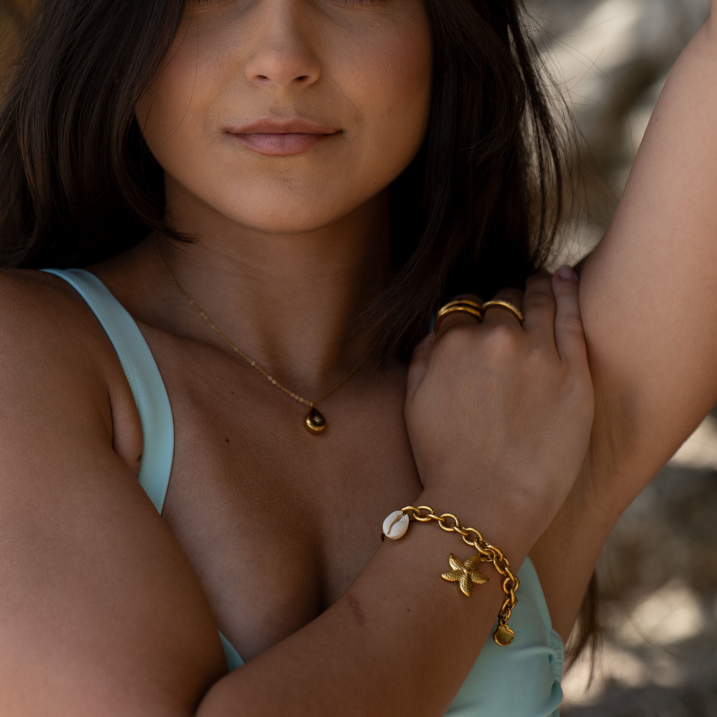 Model wearing Solara Necklace – star-set zircon pendant