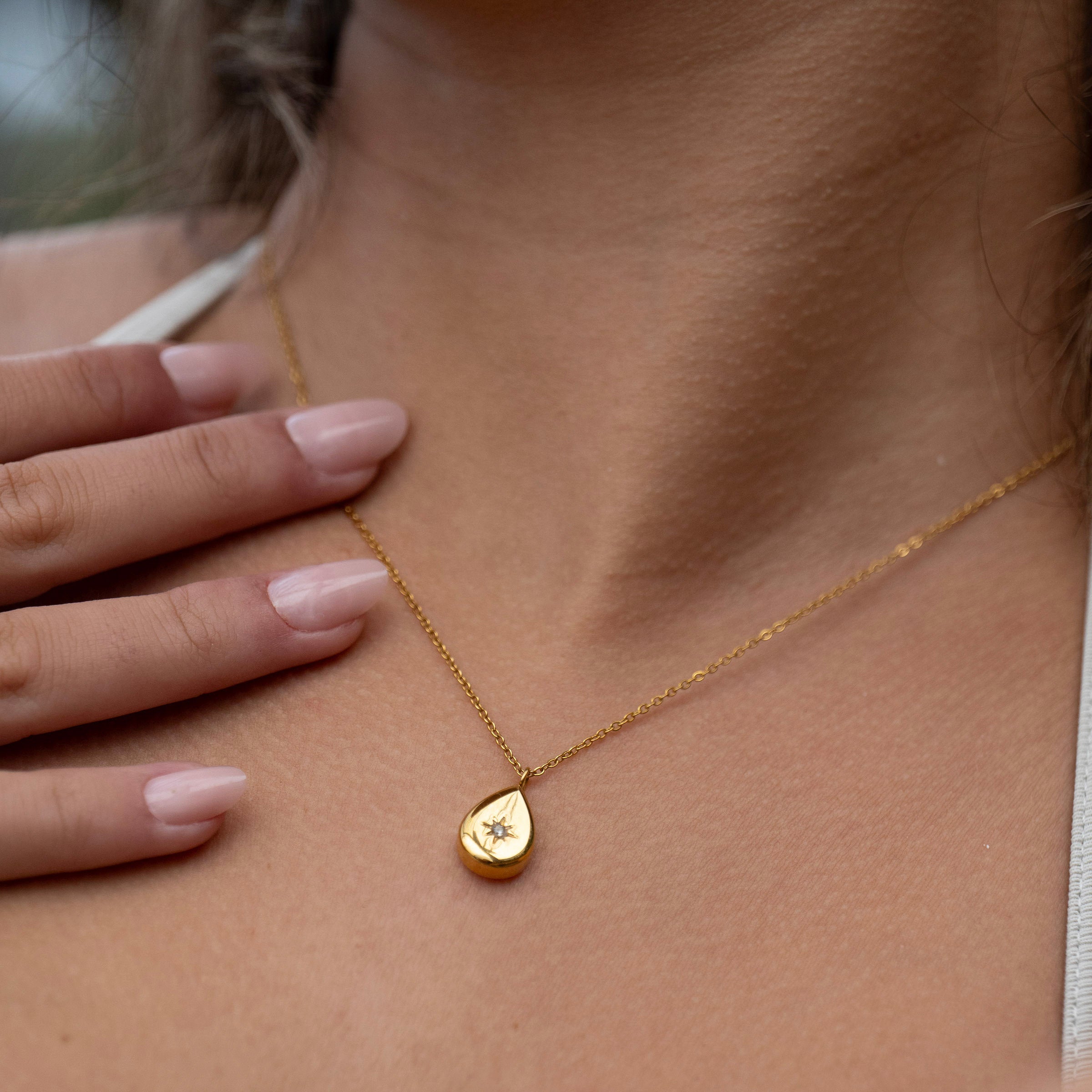 Gold teardrop pendant necklace in 18K PVD stainless steel, waterproof tarnish-free jewellery worn layered on neckline