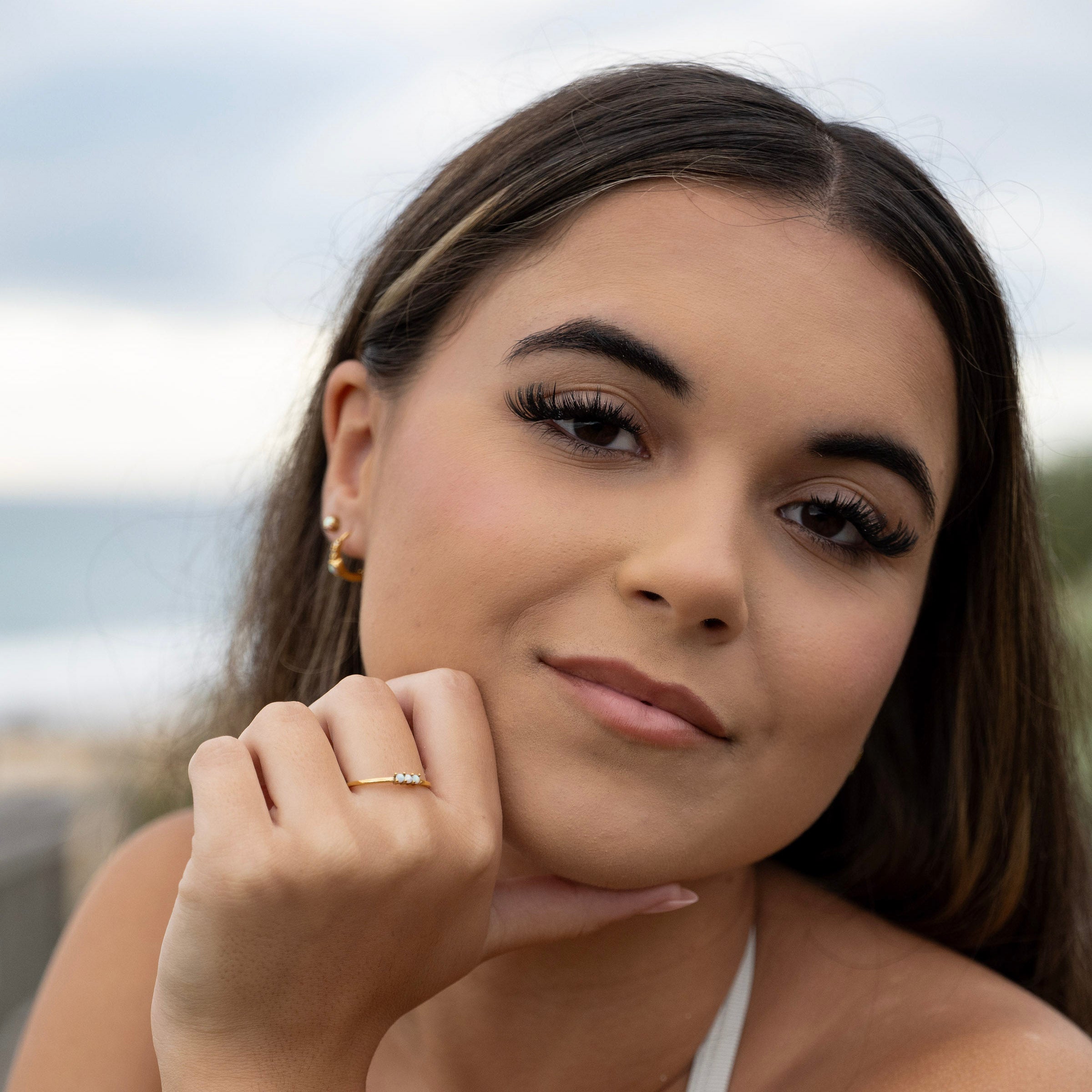 Tarnish-free opal jewellery set worn on model