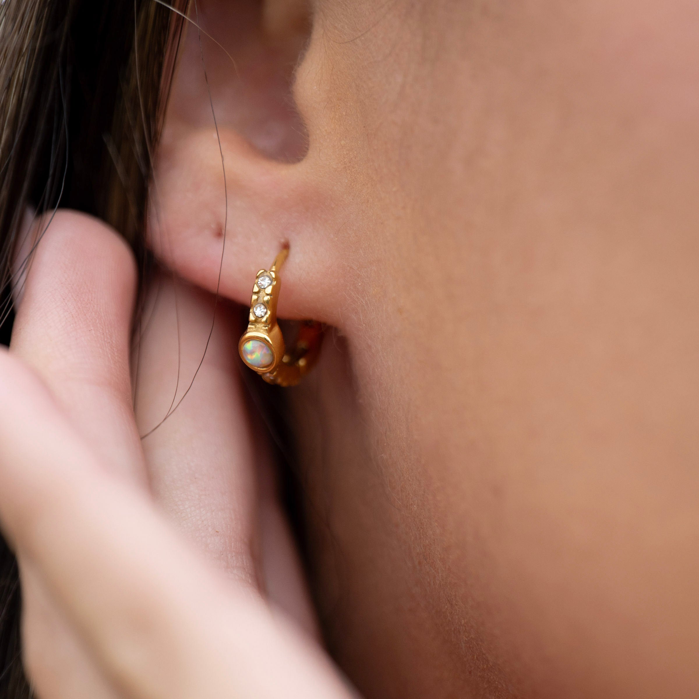 Minimal gold huggie earrings with opal gemstone and crystal accents, waterproof PVD stainless steel design