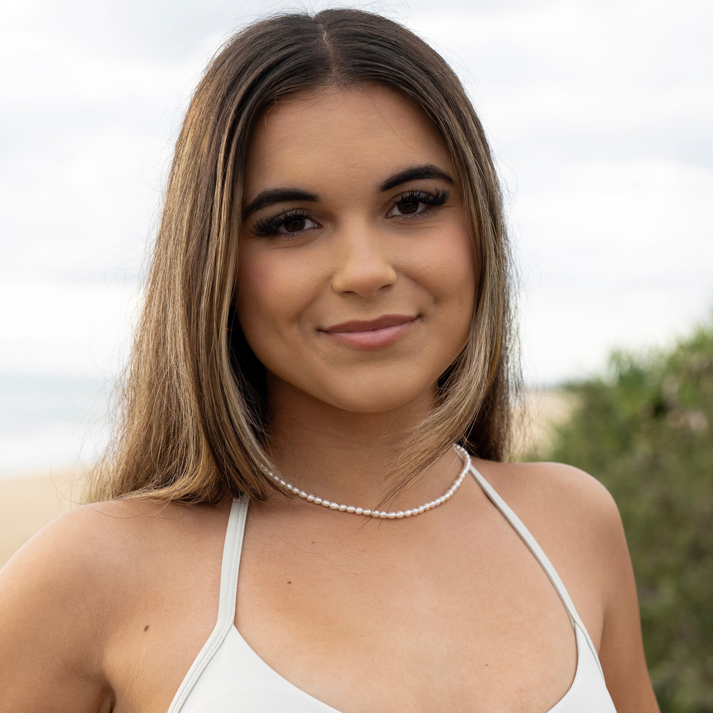 Pearl choker necklace with extender worn on model