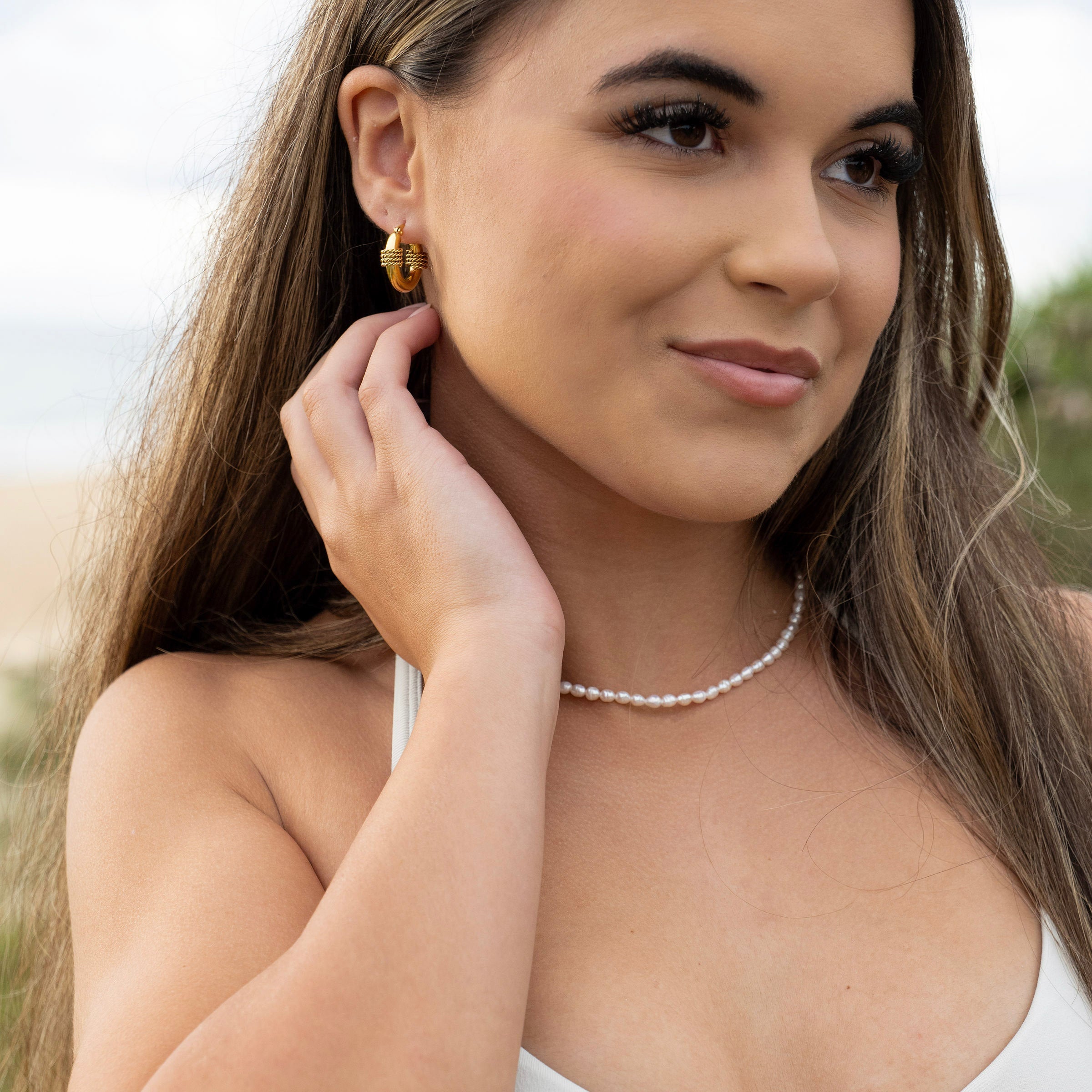 Adjustable pearl necklace styled for coastal wear