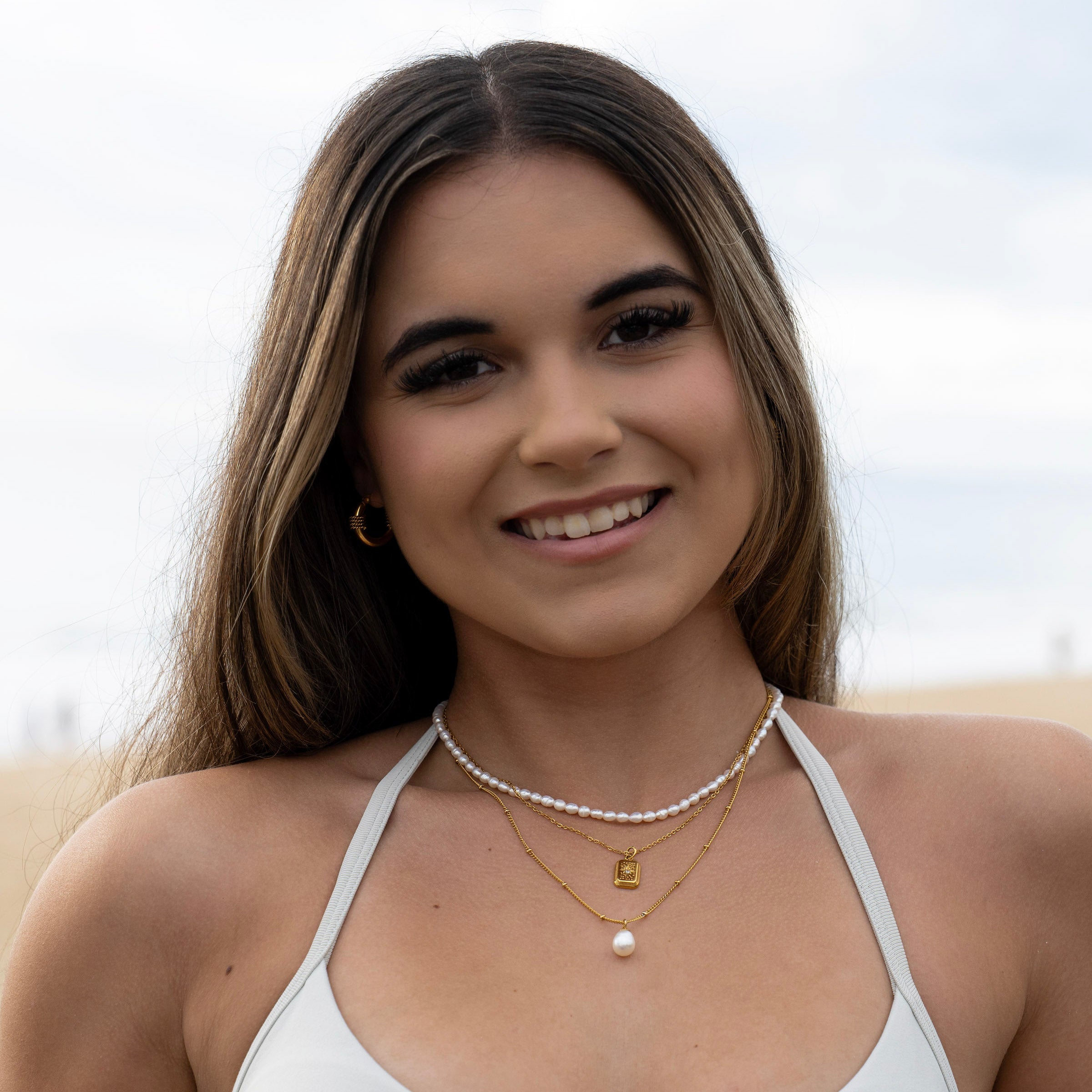 Three necklace stack with freshwater pearls and gold chains