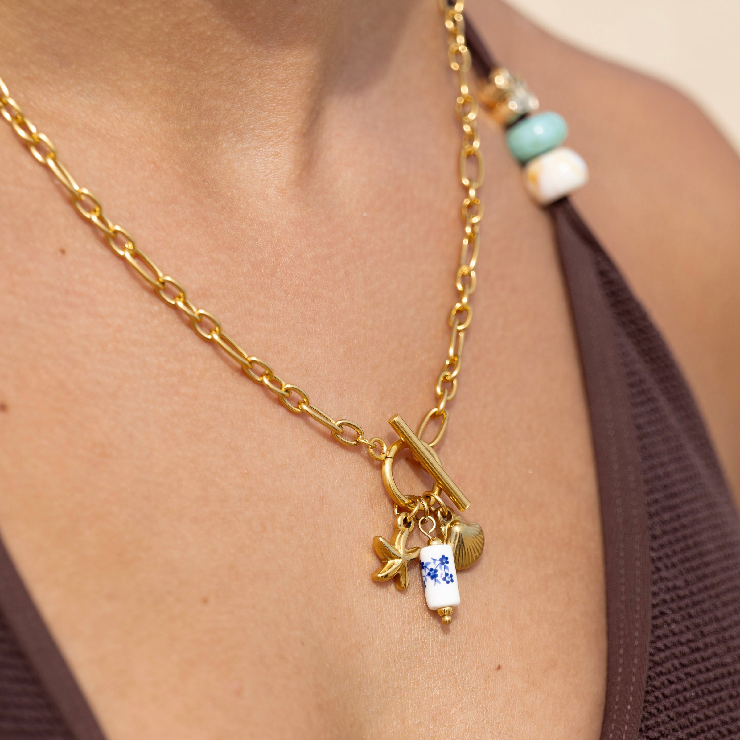 Tarnish free gold chain necklace styled for beachwear