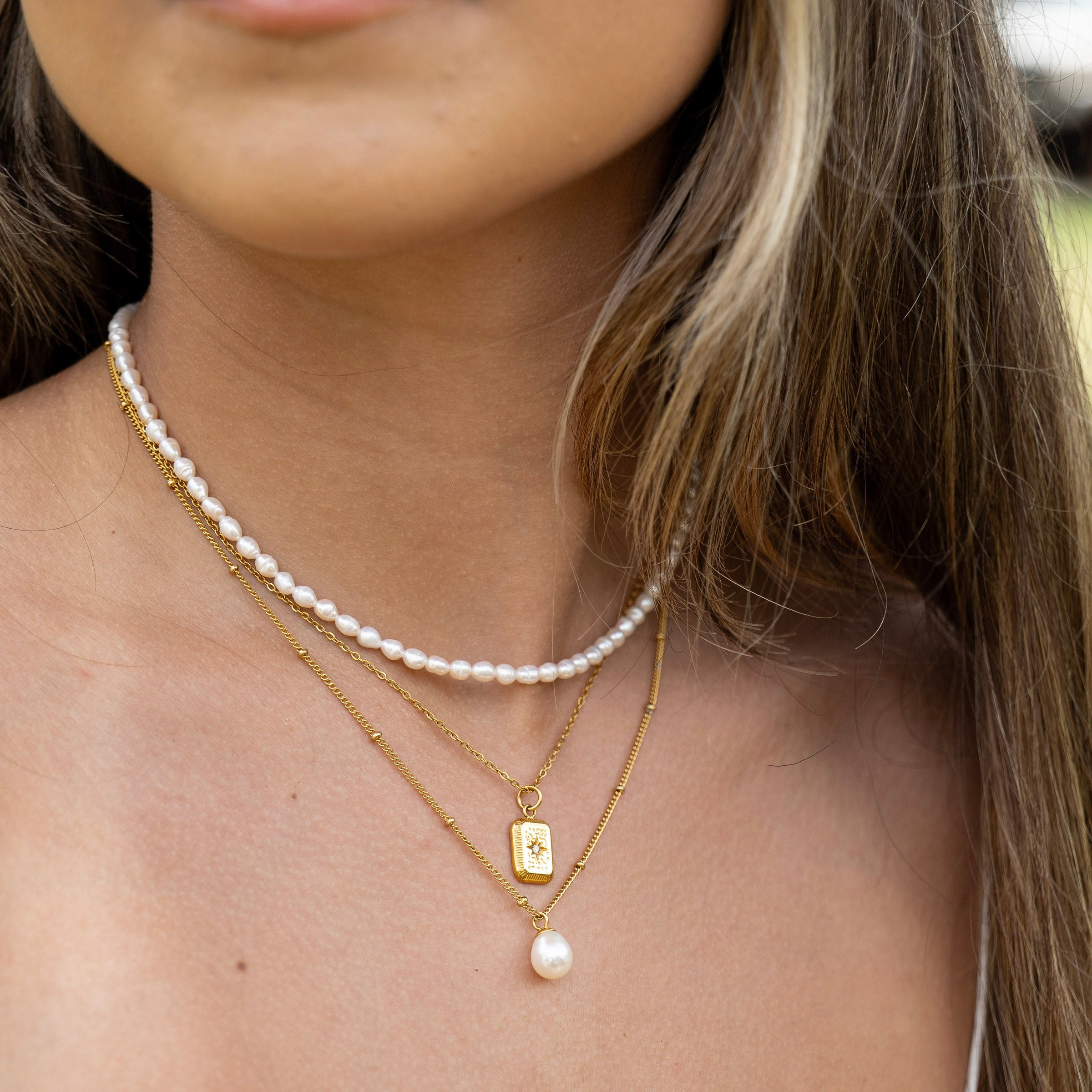 Coastal inspired layered necklace bundle close up