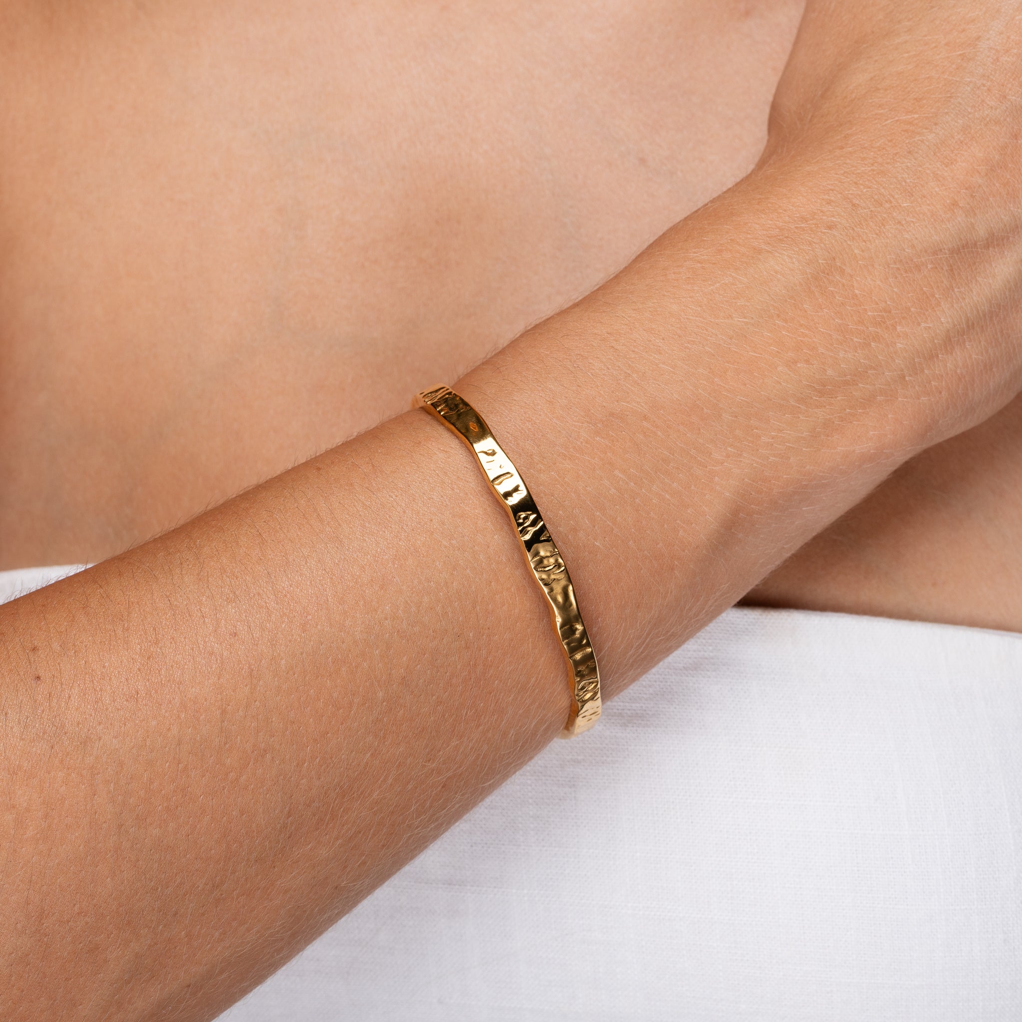Gold Erosion Cuff Bracelet on wrist – Maevi jewellery