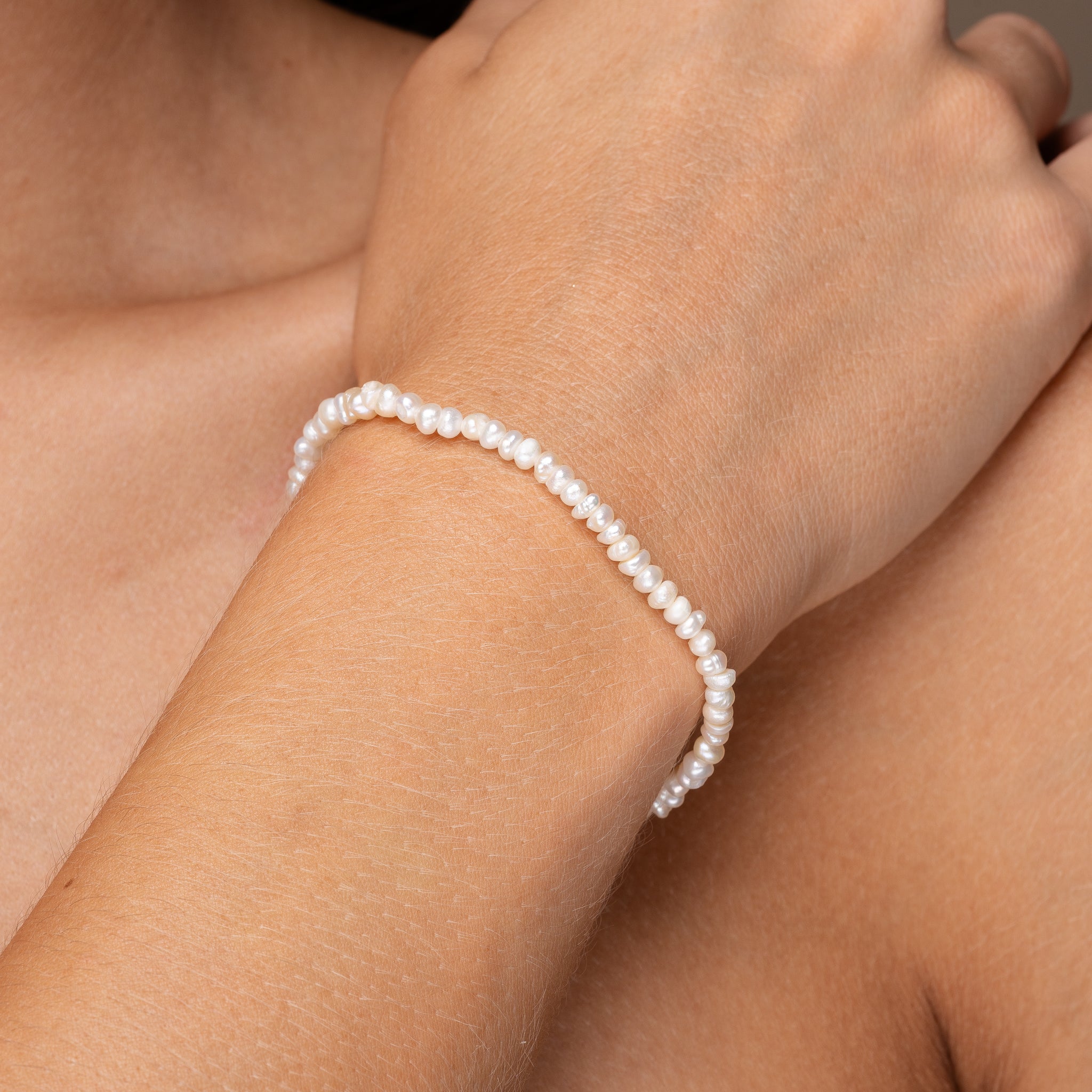 Gold and pearl bracelet on wrist – hypoallergenic